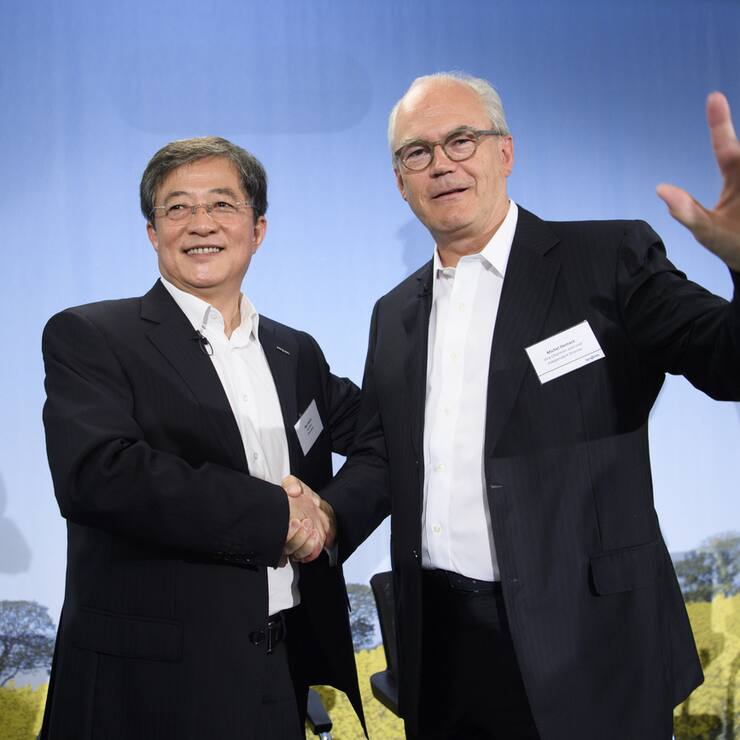 Ren Jianxin, left, chairman of ChemChina and futur  Chairman of Syngenta shakes hand with Michel Demare, right, futur vice-chairman and lead independent director of Syngenta during a press conference of Syngenta after its acquisition by ChemChina, in Basel, Tuesday, June 27, 2017. The China National Chemical Corporation, or &#x201a;"ChemChina" has acquired the worlds biggest producer of agricultural chemicals, the Swiss agribusiness company Syngenta AG. (KEYSTONE/Laurent Gillieron)