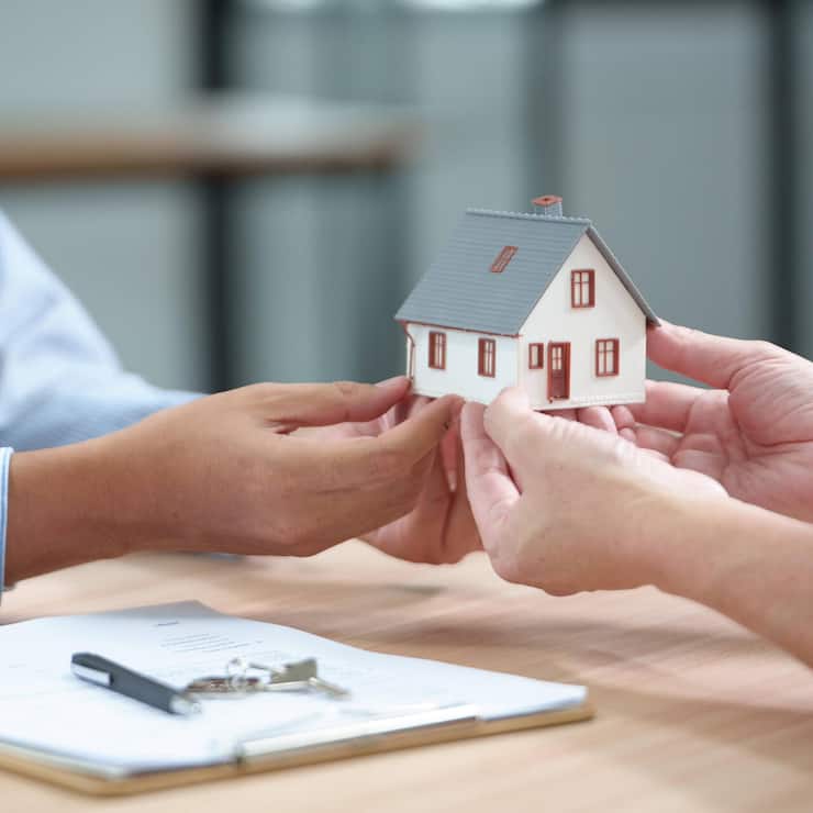 Real Estate Deal with House Model, Documents and Keys