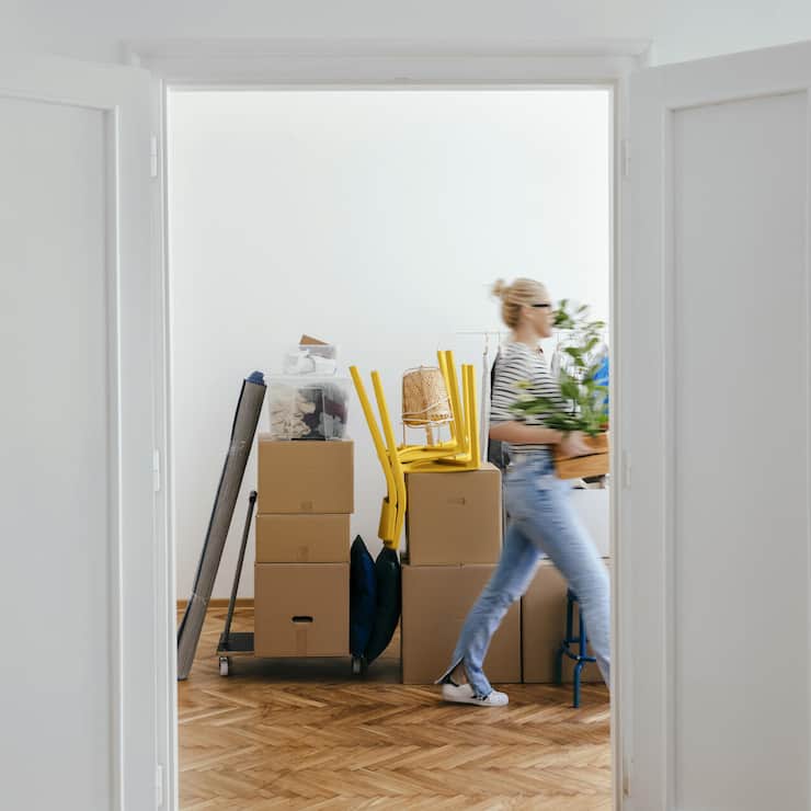 An Anonymous Woman Moving In Into New Apartment