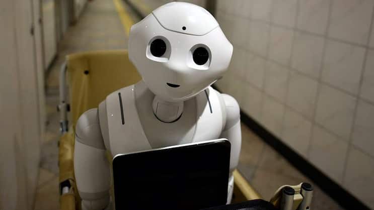 Roboter: Übernehmen immer mehr Routineaufgaben für Analysten. Keystone