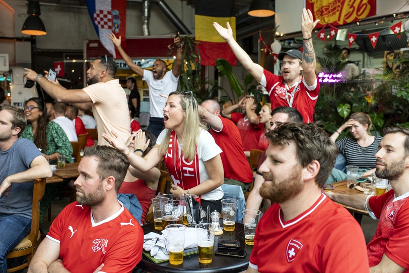 Swiss soccer fans react during the live broadcast of the UEFA EURO 2020 soccer match between Spain and Switzerland at the Amboss Rampe in Zurich, Switzerland, Friday, 2. July 2021. (KEYSTONE/Ennio Leanza).