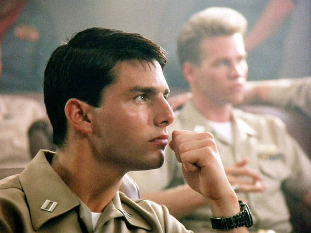LOS ANGELES - MAY 16: The movie "Top Gun", directed by Tony Scott. Seen here in foreground, Tom Cruise as Lt. Pete "Maverick" Mitchell. In background, Val Kilmer as Lt. Tom 'Iceman' Kazansky. Initial theatrical release May 16, 1986. Screen capture. Paramount Pictures. (Photo by CBS via Getty Images)