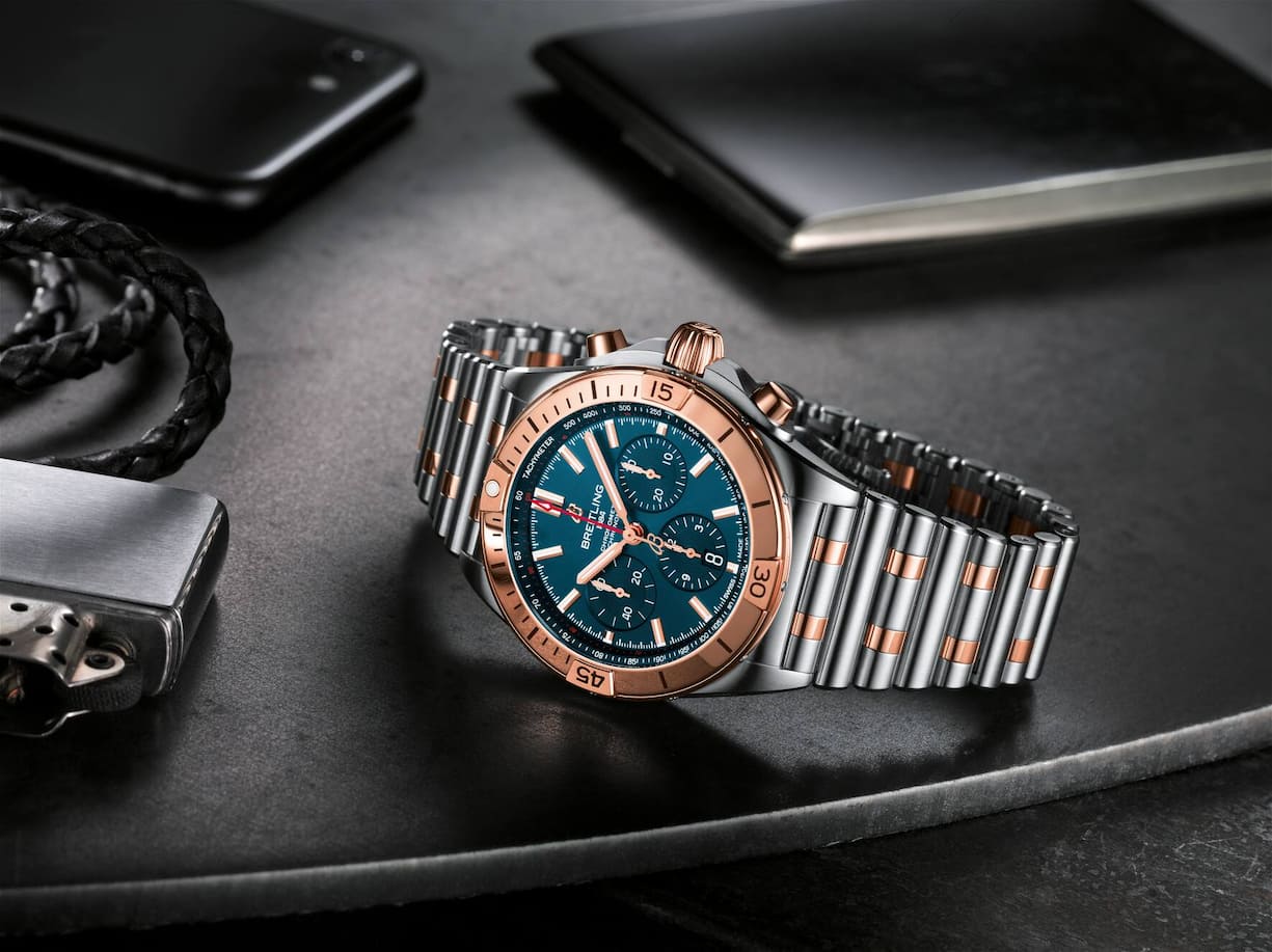 Two-tone Chronomat B01 42 with a blue dial and tone-on-tone chronograph counters highlighted by an 18 k red gold bezel, crown and pushers
