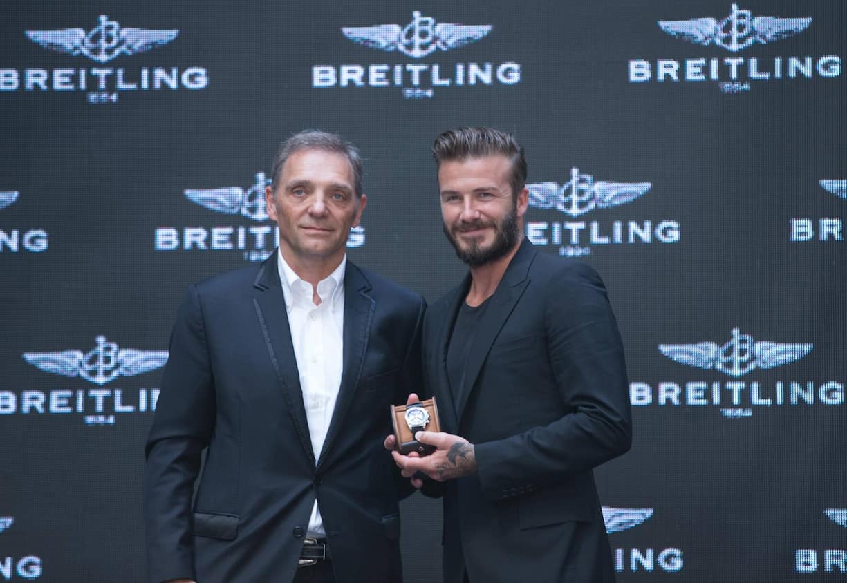 President and CEO of Breitling SA Theodore Schneider (L) and David Beckham attend a commerical event on June 12, 2014 in Beijng, China