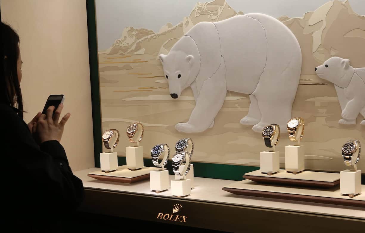 BASEL, SWITZERLAND - MARCH 21: A visitor photographs Rolex watches on the opening day of the 2019 Baselworld luxury watch and jewelry fair on March 21, 2019 in Basel, Switzerland. The Baselworld trade show runs from March 21-26. (Photo by Adam Berry/Getty Images)