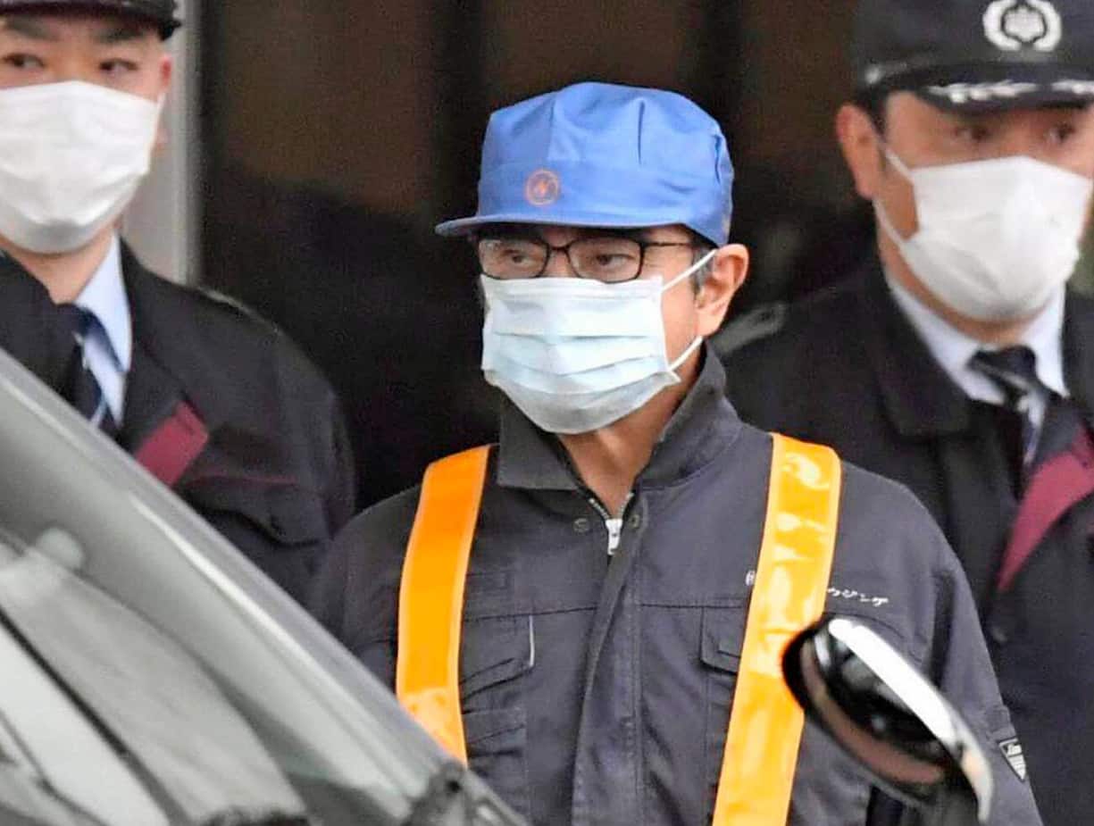 In this March 4, 2019, photo, former Nissan Chairman Carlos Ghosn, center with blue cap, leaves Tokyoâs Detention Center in Tokyo, Wednesday, March 6, 2019. Ghosn was released Wednesday after putting up 1 billion yen ( million) in bail. (Yu Nakajima/Kyodo News via AP, File)