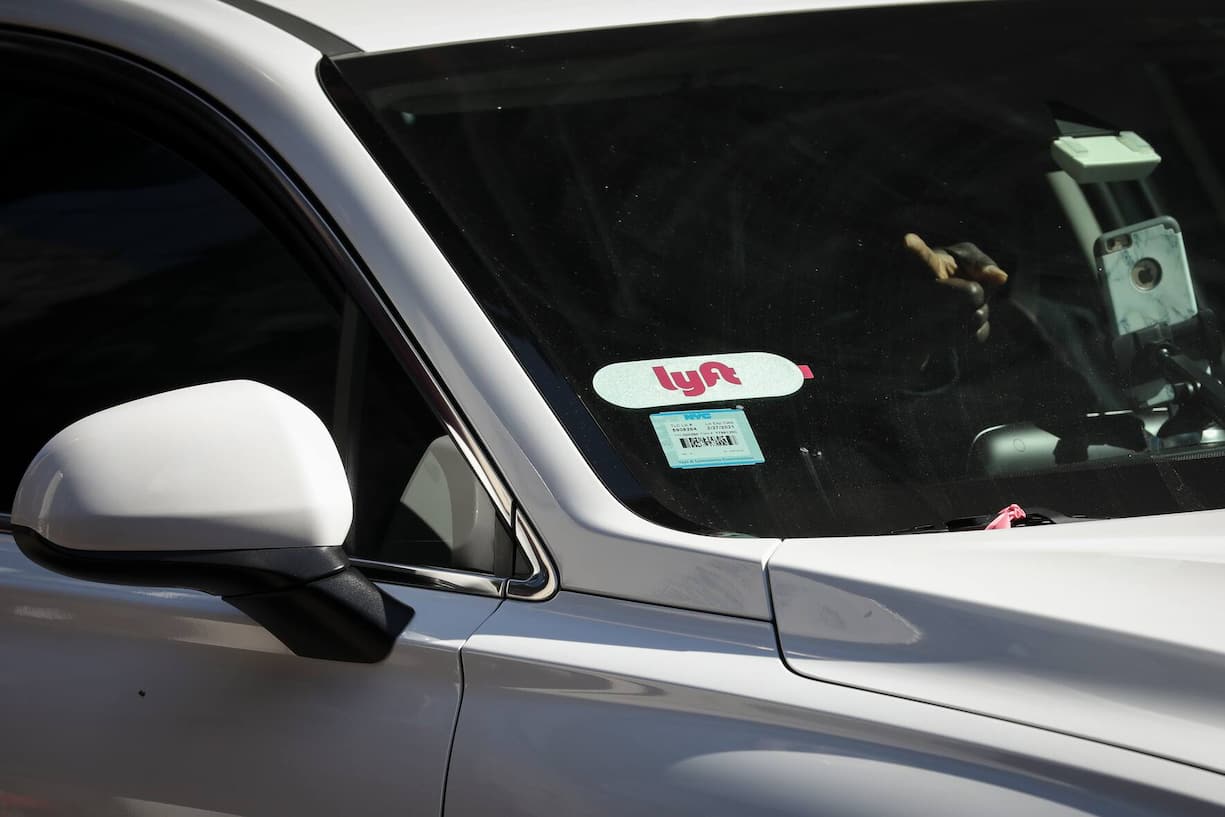 NEW YORK, NY - MARCH 19: A Lyft logo is displayed on a vehicle driving through Times Square, March 19, 2019 in New York City. Lyft, the popular ride-hailing service and competitor to Uber, is planning its initial public offering (IPO) on the NASDAQ stock exchange in the coming weeks. Lyft is projecting investors will buy the stock for between $62 and $68 per share, with the company expecting to raise over $2 billion through the sale of stock. (Photo by Drew Angerer/Getty Images)