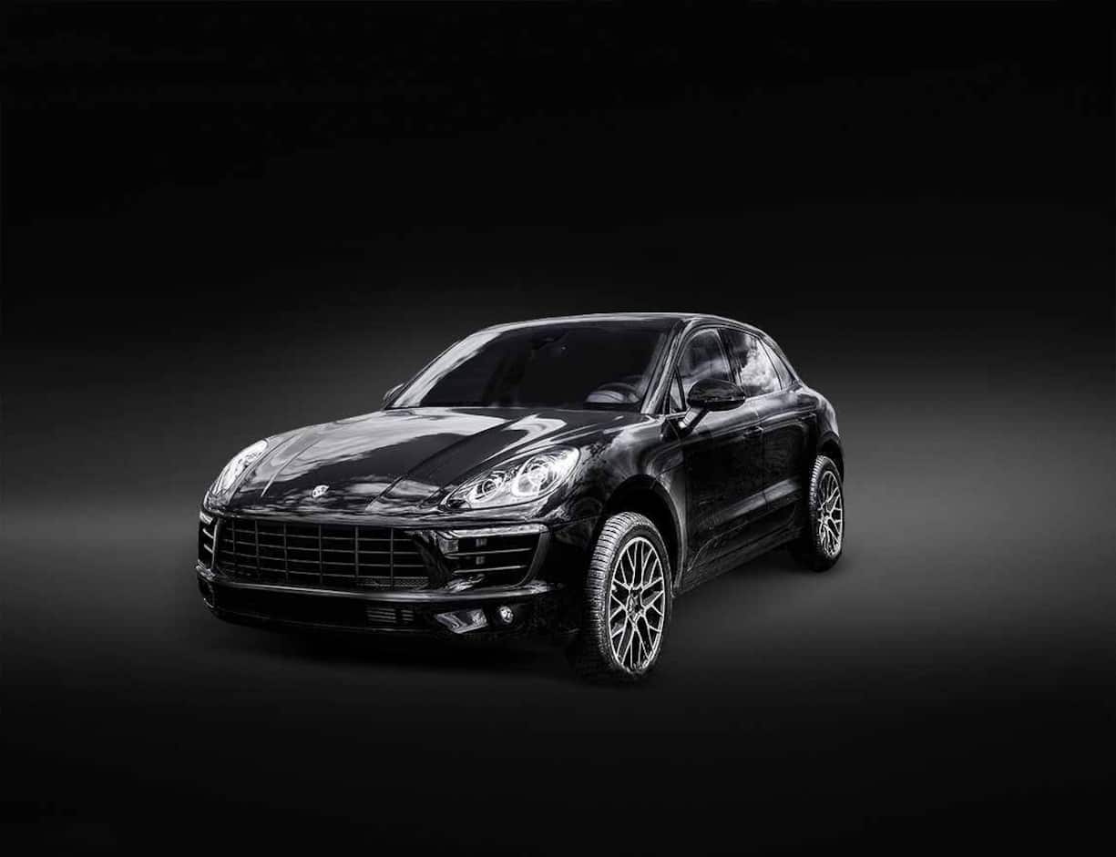 P1KE55 Porsche Macan is parked on a fresh green spring grass