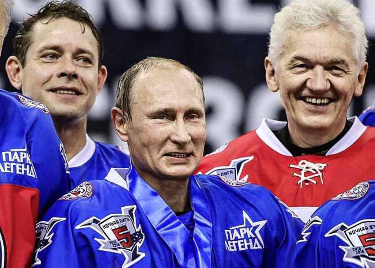SOCHI, RUSSIA - OCTOBER 07: (L-R): Former NHL player Pavel Bure, Russian President Vladimir Putin, businessman and billionaire Gennady Timchenko attend an ice hockey match of the Night Hockey League on October 7, 2015 in Sochi, Russia. Putin spends his 63-th birthday playing hockey with NHL stars. (Photo by Sasha Mordovets/Getty Images)
