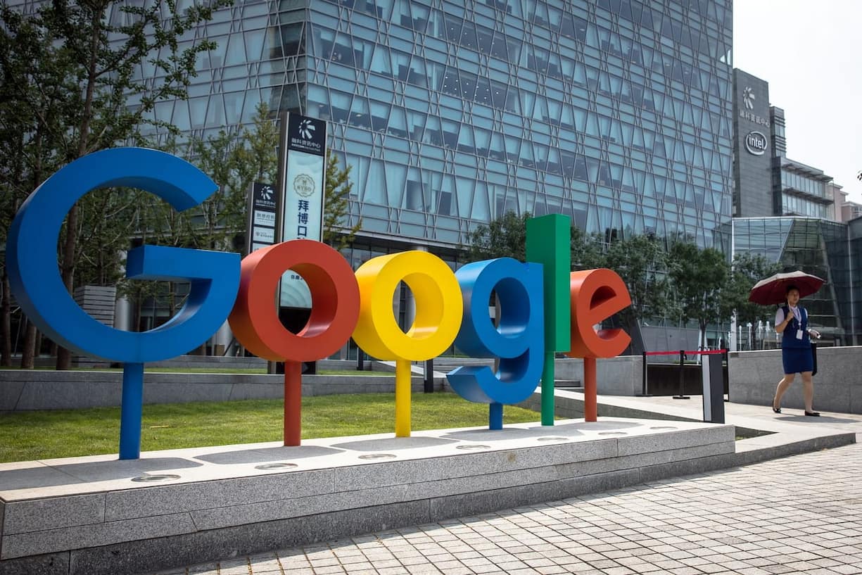 epa06994628 (FILE) - A Chinese woman walks past a 'Google' brand name and logo, near the Google office in Beijing, China, 03 August 2018 (reissued 03 September 2018). Google marks its 20th anniversary on 04 September 2018, the date in 1998 when Google founders Larry Page and Sergey Brin incorporated the company. The stock market value of Alphabet (parent company of Google) currently is 688 billion USD.  EPA/ROMAN PILIPEY
