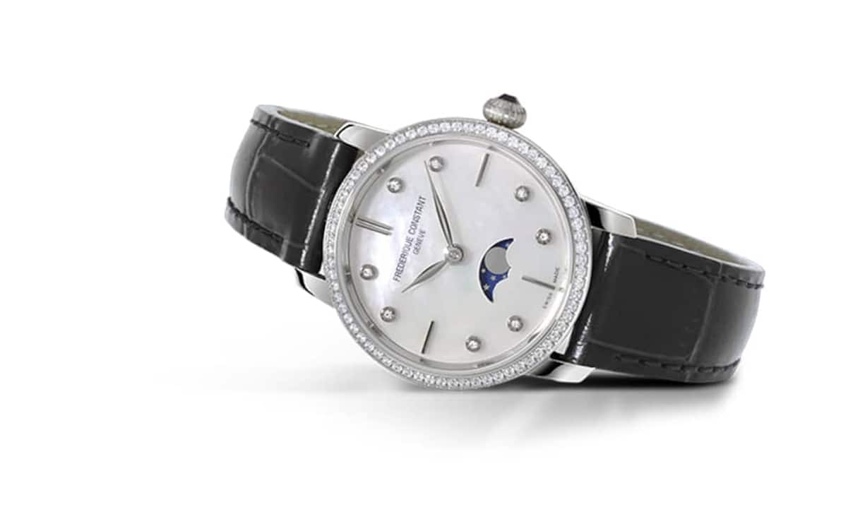 Optisch ebenso attraktiv wie finanziell: Frédérique Constant Slimline Moonphase Ladies mit Anzeige der Mondphase bei sechs Uhr, sertierter Lünette und Diamanten-Indizes.