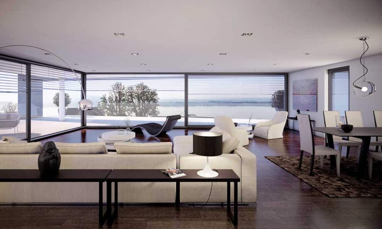 Die Glasfronten bieten viel Licht und Weitblick, der Sichtbeton bringt moderne und kühle Eleganz.