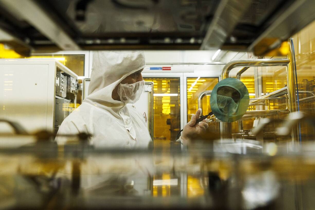 A technician inspects a semiconductor wafer during testing in the cleanroom at the Tower Semiconductor Ltd. plant in Migdal HaEmek, Israel, on Monday, Feb. 28, 2022. Intel Corp. agreed to acquire Tower Semiconductor for about $5.4 billion, part of Chief Executive Officer Pat Gelsingers push into the outsourced chip-manufacturing business. Photographer: Kobi Wolf/Bloomberg