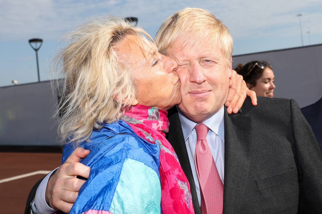 DOVER, ENGLAND - JULY 11: Boris Johnson is kissed by a member of the public during a visit to the Port of Dover Ltd., as part of his Conservative Party leadership campaign tour on July 11, 2019 in Dover, United Kingdom. Boris Johnson and Jeremy Hunt are the remaining candidates in contention for the Conservative Party Leadership and thus Prime Minister of the UK. Results will be announced on July 23rd 2019. (Photo by Chris Ratcliffe - Pool/Getty Images)
