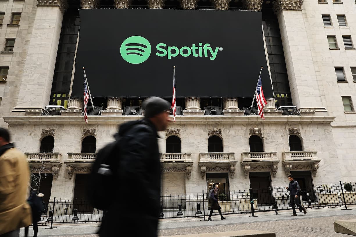 NEW YORK, NY - APRIL 03:  The Spotify banner hangs from the New York Stock Exchange (NYSE) on the morning that the music streaming service begins trading shares at the NYSE on April 3, 2018 in New York City.  Trading under the symbol SPOT, the Swedish company's losses grew to 1.235 billion euros ($1.507 billion) last year, its largest ever.  (Photo by Spencer Platt/Getty Images)