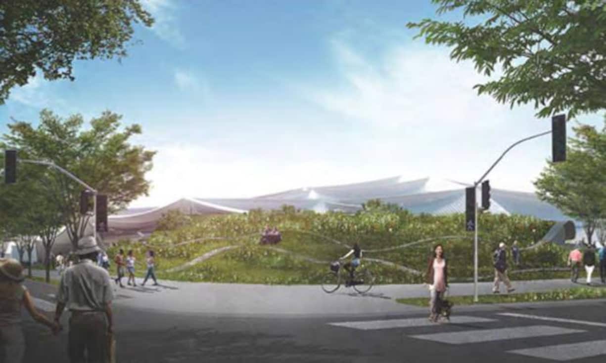 Unter diesem grünen Hügel sind betriebliche Anlagen versteckt, im Hintergrund ist das künftige Hauptgebäude des Google-Campus erkennbar.