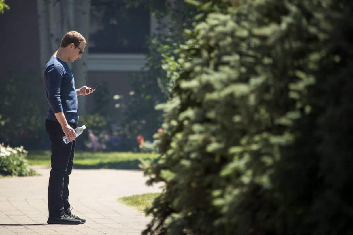 SUN VALLEY, ID - JULY 13: Mark Zuckerberg, chief executive officer of Facebook, checks his phone during the annual Allen & Company Sun Valley Conference, July 13, 2018 in Sun Valley, Idaho. Every July, some of the world's most wealthy and powerful businesspeople from the media, finance, technology and political spheres converge at the Sun Valley Resort for the exclusive weeklong conference. (Photo by Drew Angerer/Getty Images)