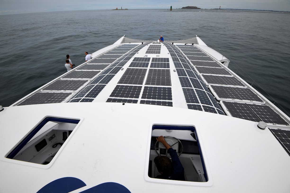 This photo taken on June 23, 2017 shows the the self-energy producing multihull "Energy Observer," off the coasts of Saint-Malo, western France. - The Energy Observer, an autonomous boat powered by hydrogen and renewable energy, is in preparation for a world tour in six years. (Photo by DAMIEN MEYER / AFP)