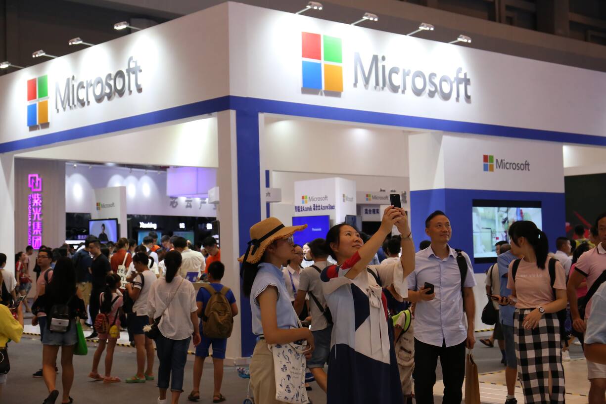 CHONGQING, CHINA - AUGUST 23: People visit the Microsoft pavilion during the Smart China Expo at Chongqing International Expo Center on August 23, 2018 in Chongqing, China. The first Smart China Expo with the theme of 'Smart Technology: Empowering Economy, Enriching Life' is held on August 23-25 in Chongqing. (Photo by VCG/VCG via Getty Images)