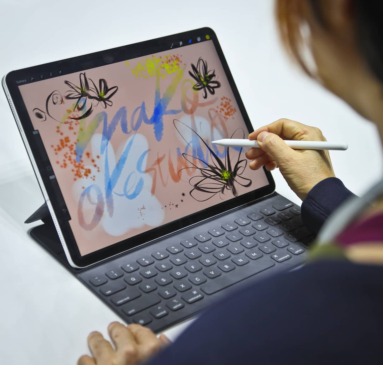 Japanese artist Mako Oke draws on the new iPad Pro using its pencil accessory after an event announcing new products Tuesday Oct. 30, 2018, in the Brooklyn borough of New York. (AP Photo/Bebeto Matthews)