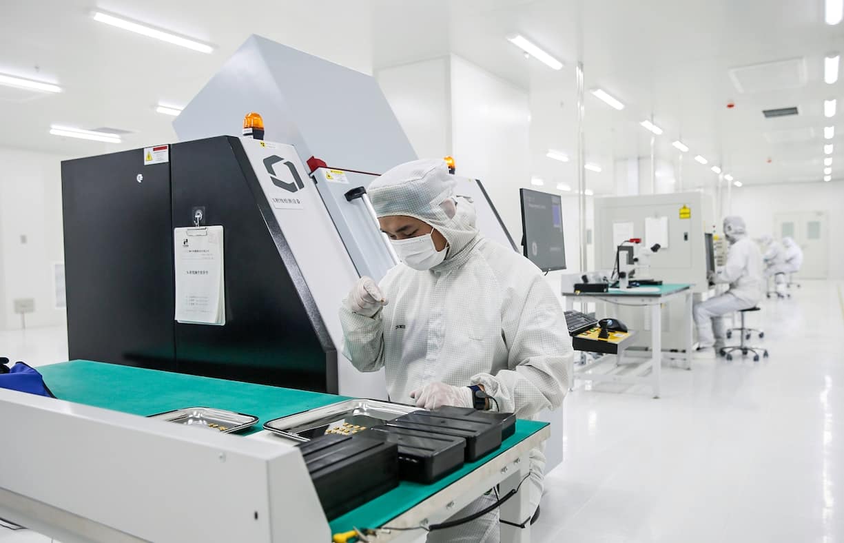 SANMENXIA, CHINA - JULY 15: An employee works in the workshop of a chip manufacturing enterprise on July 15, 2021 in Sanmenxia, Henan Province of China. (Photo by Sun Meng/VCG via Getty Images)