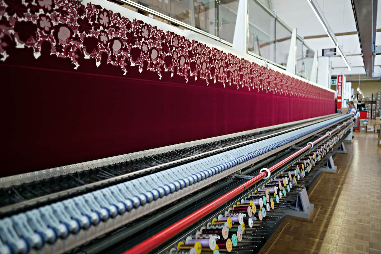 An embroidery machine, manufactured by Saurer AG, embroiders a textile in the stitching hall at the Forster Rohner AG textile production workshop in St Gallen, Switzerland, on Wednesday, May 31, 2017. Forster Rohner, a 113-year-old company in the eastern city of St. Gallen, produces fabric that can cost thousands of dollars per yardincluding material used in the dress that British socialite Pippa Middleton wore at her wedding in May. Photographer: Michele Limina/Bloomberg via Getty Images