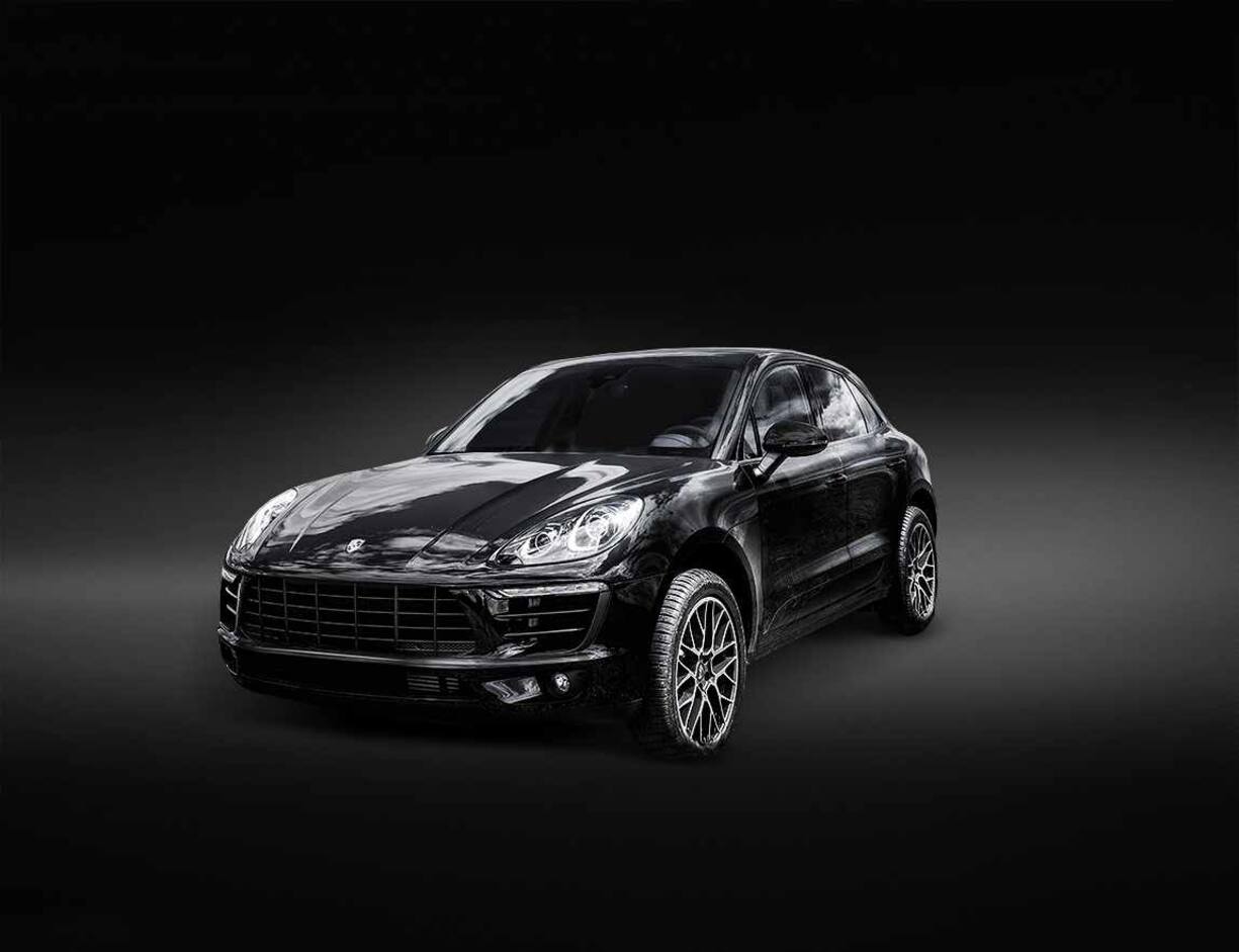 P1KE55 Porsche Macan is parked on a fresh green spring grass