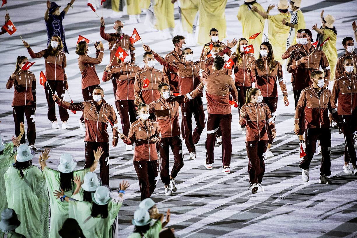 Swiss athletes parade during the opening ceremony of the 2020 Tokyo Summer Olympics at the National Stadium in Tokyo, Japan, Friday, July 23, 2021. (KEYSTONE/Laurent Gillieron)