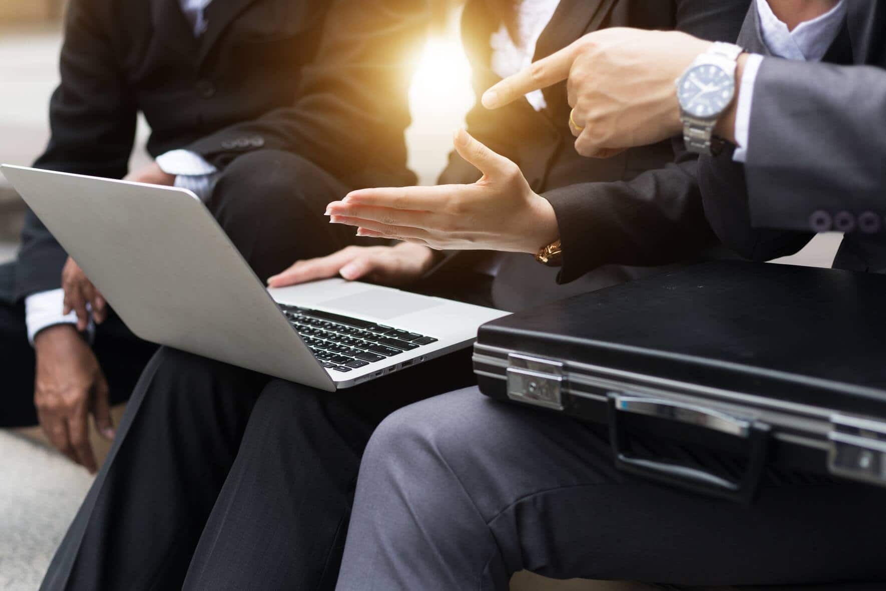 Team job. Photo young businessmans crew working with new startup project in modern loft. Generic design notebook