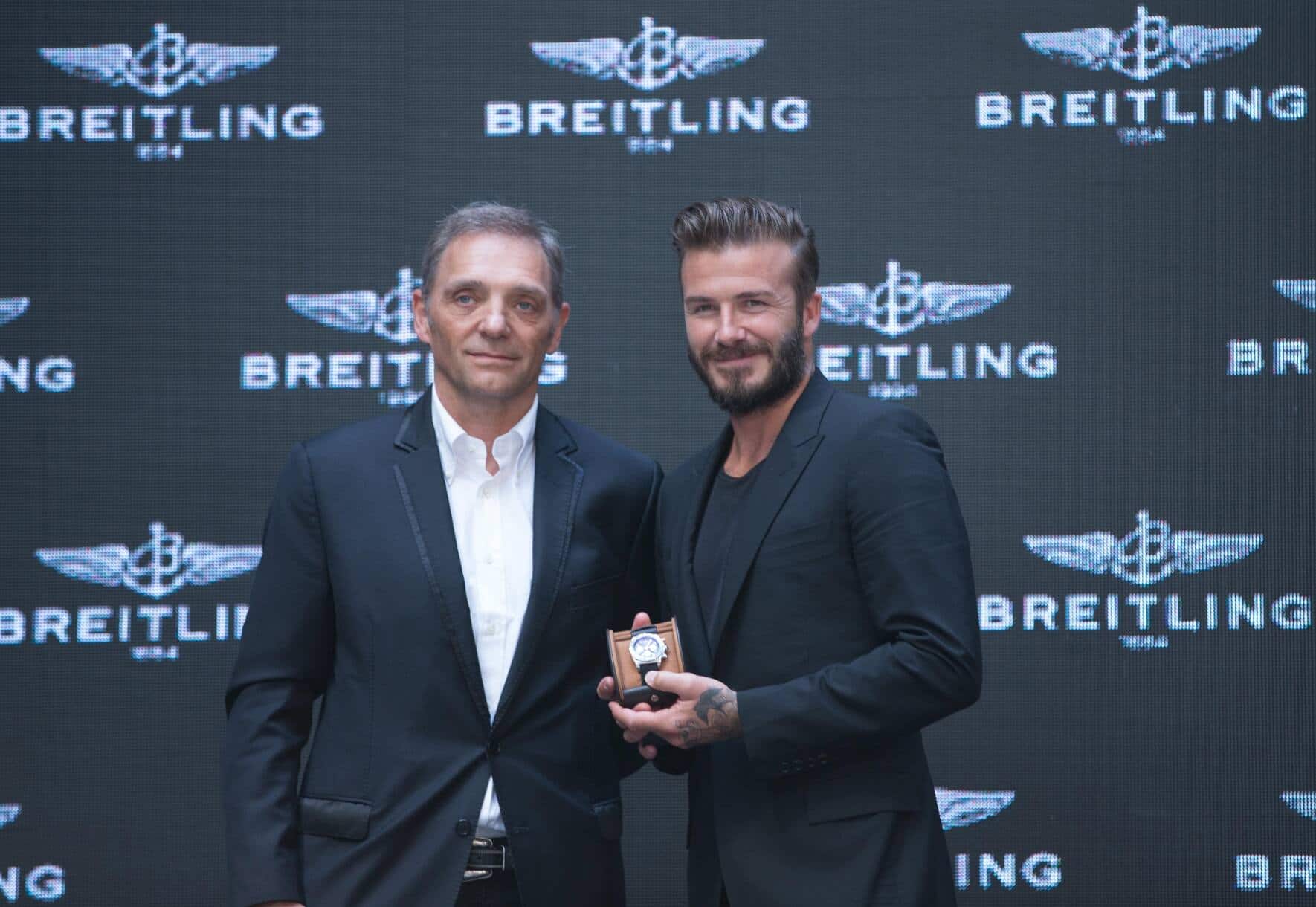 President and CEO of Breitling SA Theodore Schneider (L) and David Beckham attend a commerical event on June 12, 2014 in Beijng, China