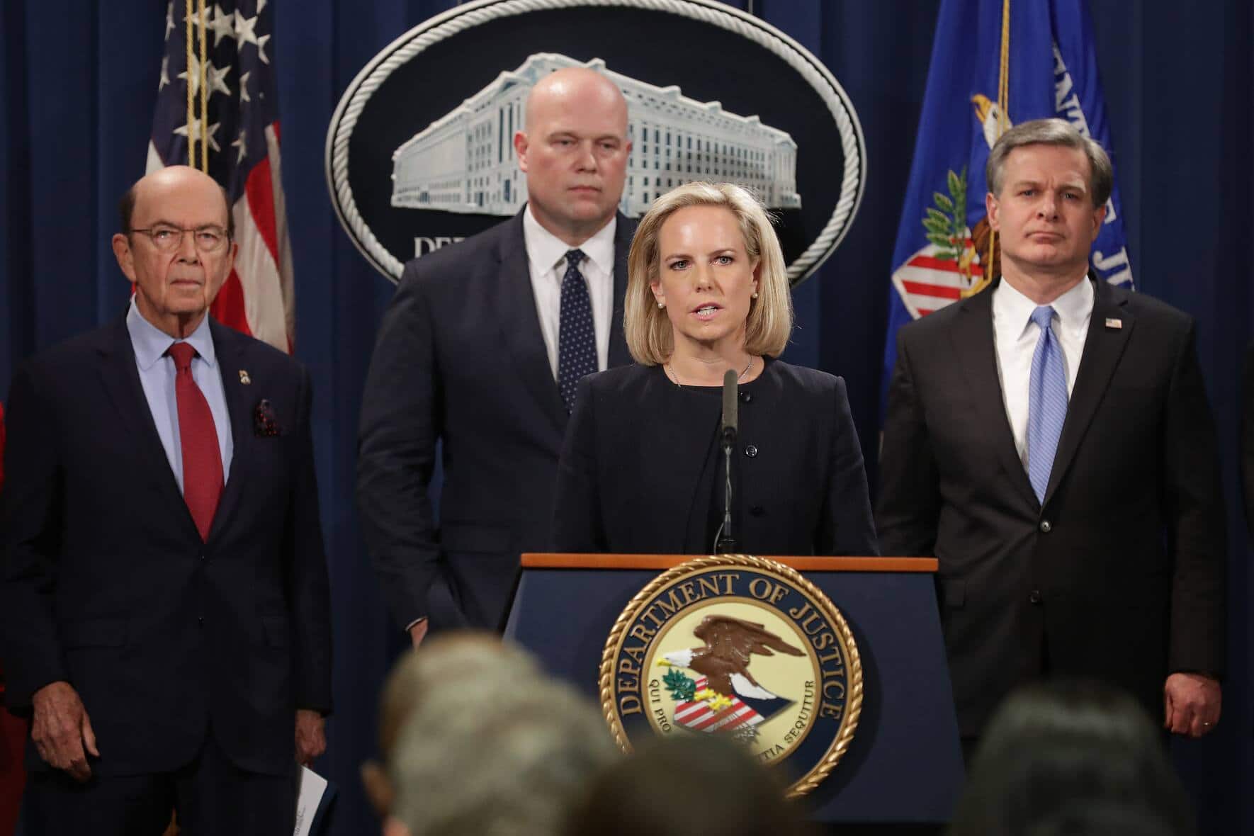 WASHINGTON, DC - JANUARY 28: (L-R) U.S. Commerce Secretary Wilbur Ross, acting Attorney General Matthew Whitaker, Homeland Security Secretary Kirstjen Nielsen and Federal Bureau of Investigation Director Christopher Wray announce new criminal charges against Chinese telecommunications giant Huawei at the Department of Justice January 28, 2019 in Washington, DC. The Justice Department is charging Huawei and its American affiliate with theft of trade secrets, wire fraud, and obstruction of justice.