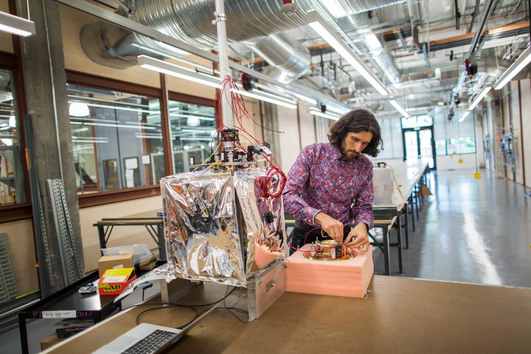 Christopher Schuster, Manager of The Project Loan Lab at Google, works on a flight electronics system for the Loon balloons inside the top secret Google X research lab. (Photo by Brooks Kraft LLC/Corbis via Getty Images)
