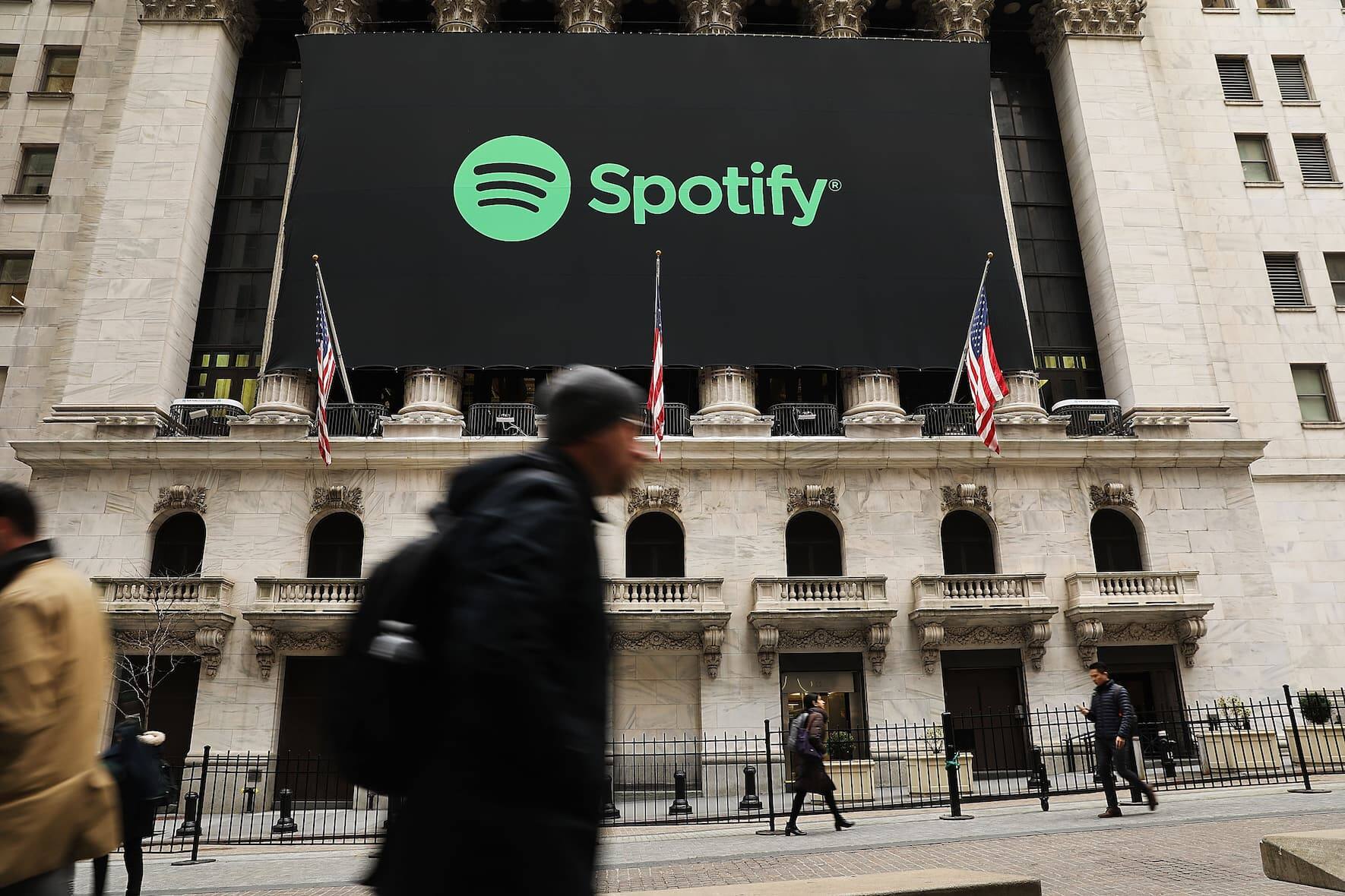 NEW YORK, NY - APRIL 03:  The Spotify banner hangs from the New York Stock Exchange (NYSE) on the morning that the music streaming service begins trading shares at the NYSE on April 3, 2018 in New York City.  Trading under the symbol SPOT, the Swedish company's losses grew to 1.235 billion euros ($1.507 billion) last year, its largest ever.  (Photo by Spencer Platt/Getty Images)