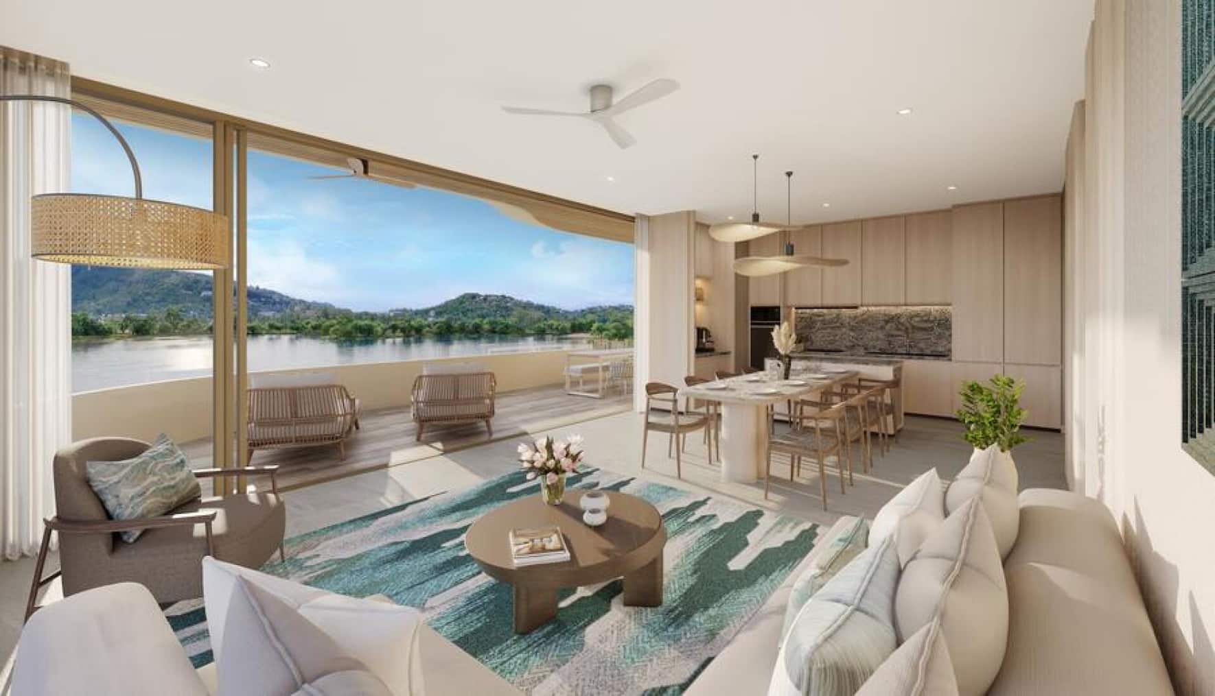 Wohnzimmer in einem Apartment mit drei Schlafzimmern von Banyan Group Residences in Bang Tao, Phuket, Thailand.
