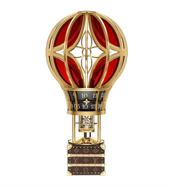 Tischuhr Montgolfière Aéro: Ein Heissluftballon transportiert den kleinsten jemals von Louis Vuitton gestalteten Koffer, in dem ein mechanisches Uhrwerk arbeitet.