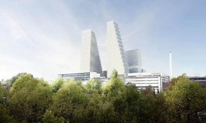 ... denn nach den Plänen von Herzog & de Meuron bekommt das Gebäude bis 2021 einen 205 Meter hohen Zwilling. Der gesamte Roche Campus soll drei Milliarden Franken kosten und wird das Gesicht der Stadt Basel grundlegend verändern. Roche