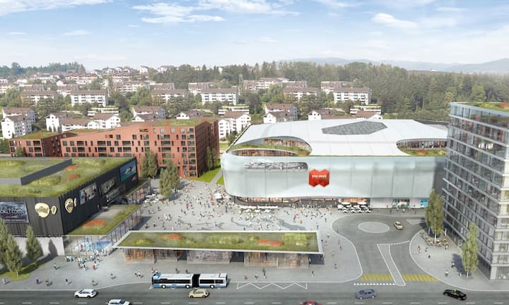 Die Fassade des Hauptgebäudes wird mit einem Leuchtteppich umhüllt – wie die Münchner Allianz Arena.