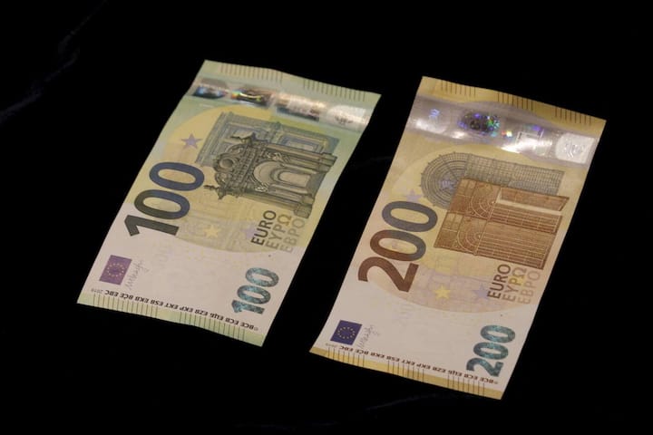 epa07596702 A view of new euro banknotes in Riga, Latvia, 24 May 2019. Latvia will be launching new 100 euro and 200 euro banknotes On 28th May 2019. These are the latest European series of banknotes with refurbished design and advanced security features. EPA/Toms Kalnins