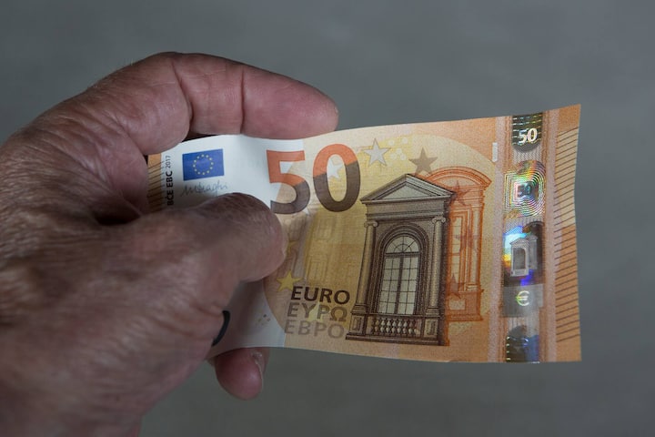 GERMANY, FRANKFURT - JULY 13: Feeling, seeing, titting-a number of important security features on the new 50 Euro banknotes which are circulated in the spring 2017th. The photo shows  the front side of the new banknote. (Photo by Ulrich Baumgarten via Getty Images)