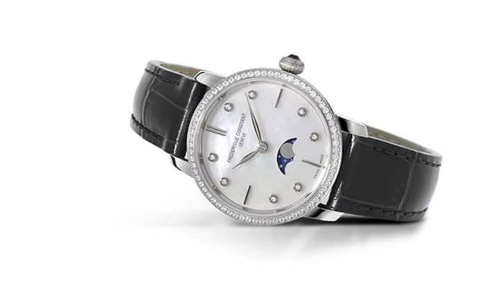 Optisch ebenso attraktiv wie finanziell: Frédérique Constant Slimline Moonphase Ladies mit Anzeige der Mondphase bei sechs Uhr, sertierter Lünette und Diamanten-Indizes.