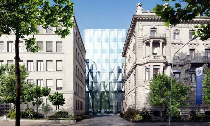 Zurich: Mit einem ähnlichen Konzept steht ein paar Häuser weiter die Zurich Insurance Group seit 2010 mit dem Projekt Quai Zurich in den Startlöchern. Das Ziel: Mehr Platz schaffen für eine Arbeitsplatzumgebung für rund 1300 Mitarbeitende. Hierfür treffen an der Zürcher Alfred-Escher-Strasse historische und moderne Fassaden aufeinander.