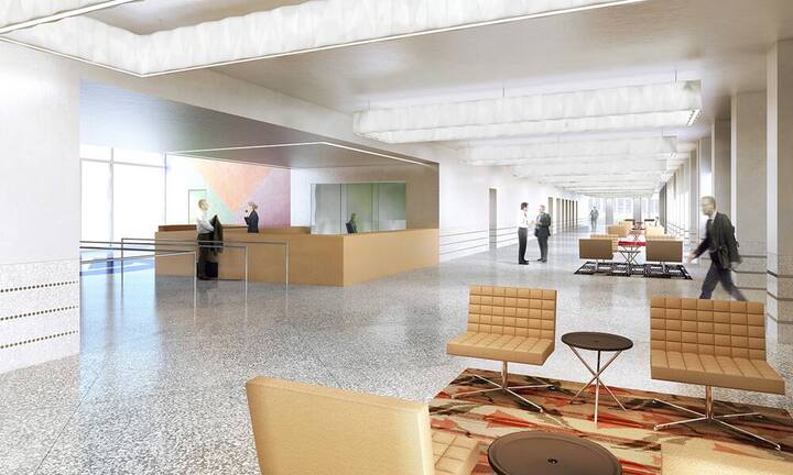 Innen führt der Weg zu den Fahrstühlen, dem Restaurant oder dem Auditorium durch die Halle.