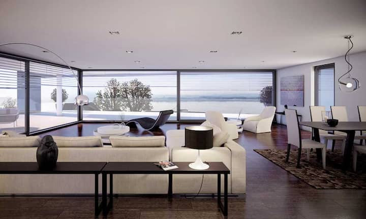 Die Glasfronten bieten viel Licht und Weitblick, der Sichtbeton bringt moderne und kühle Eleganz.