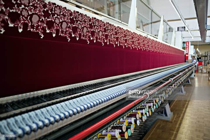 An embroidery machine, manufactured by Saurer AG, embroiders a textile in the stitching hall at the Forster Rohner AG textile production workshop in St Gallen, Switzerland, on Wednesday, May 31, 2017. Forster Rohner, a 113-year-old company in the eastern city of St. Gallen, produces fabric that can cost thousands of dollars per yardincluding material used in the dress that British socialite Pippa Middleton wore at her wedding in May. Photographer: Michele Limina/Bloomberg via Getty Images
