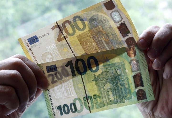 epa07596696 A view of new euro banknotes in Riga, Latvia, 24 May 2019. Latvia will be launching new 100 euro and 200 euro banknotes On 28th May 2019. These are the latest European series of banknotes with refurbished design and advanced security features. EPA/Toms Kalnins