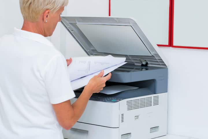 Nurse at work...using photocopier,copiing medical results