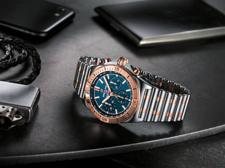 Two-tone Chronomat B01 42 with a blue dial and tone-on-tone chronograph counters highlighted by an 18 k red gold bezel, crown and pushers