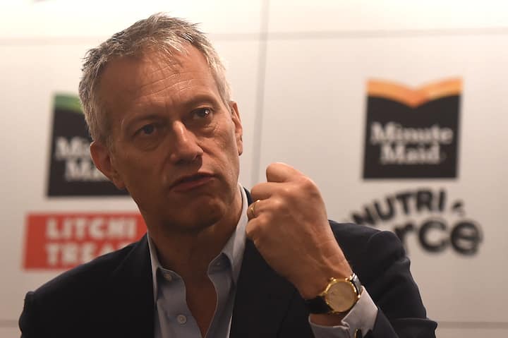 Chairman and CEO of The Coca-Cola Company, James Quincey, gestures as he addresses a press conference in Mumbai on March 2, 2020. (Photo by Punit PARANJPE / AFP)