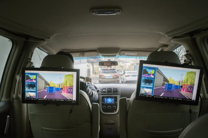 Screens show a demonstration of the cognition level of Horizon Robotics Inc.'s Journey processor onboard a vehicle during a test drive in Beijing, China, on Friday, March 23, 2018. China's aspiration to deploy 30 million autonomous vehicles within a decade is seeding a fledgling chip industry, with startups like Horizon Robotics emerging to build the brains behind those wheels. Photographer: Giulia Marchi/Bloomberg