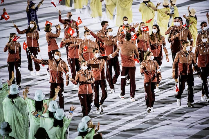 Swiss athletes parade during the opening ceremony of the 2020 Tokyo Summer Olympics at the National Stadium in Tokyo, Japan, Friday, July 23, 2021. (KEYSTONE/Laurent Gillieron)
